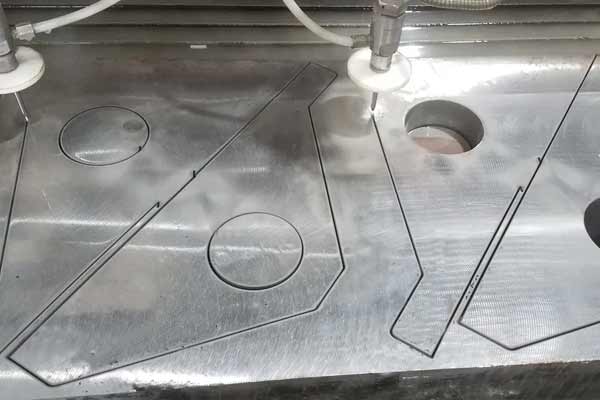 Where-water-jet-cutting-is-used-in-machine-shops Where-water-jet-cutting-is-used-in-machine-shops